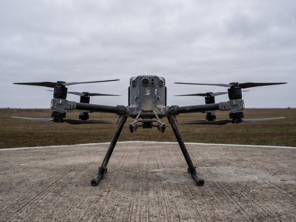 An industrial quadcopter on a landing pad